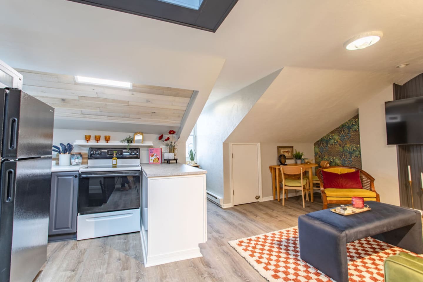Step into this vibrant 1-bedroom apartment and be captivated by the stylish, open-concept design. The compact kitchen, though small, is thoughtfully designed with bold decor and sleek finishes, seamlessly blending with the cozy living area. This chic