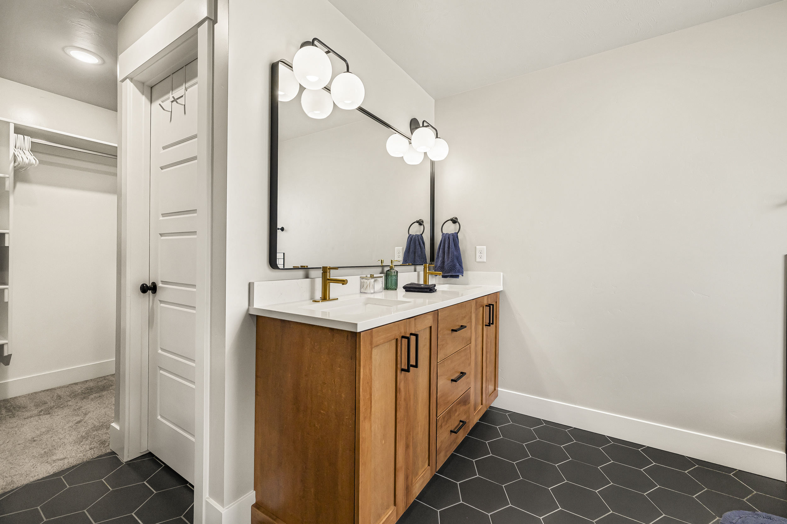 Master bathroom with entrance to walk in closet.