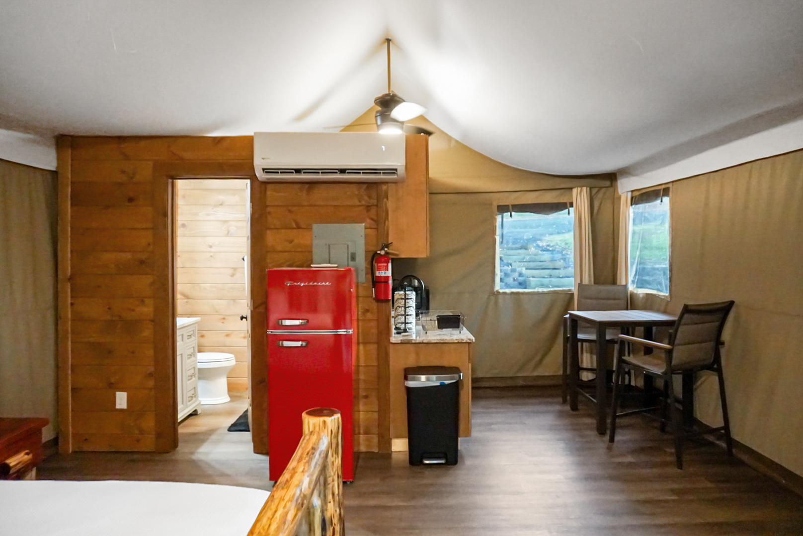 Kitchenette: Enjoy a vibrant red fridge and rustic charm for your culinary adventures!