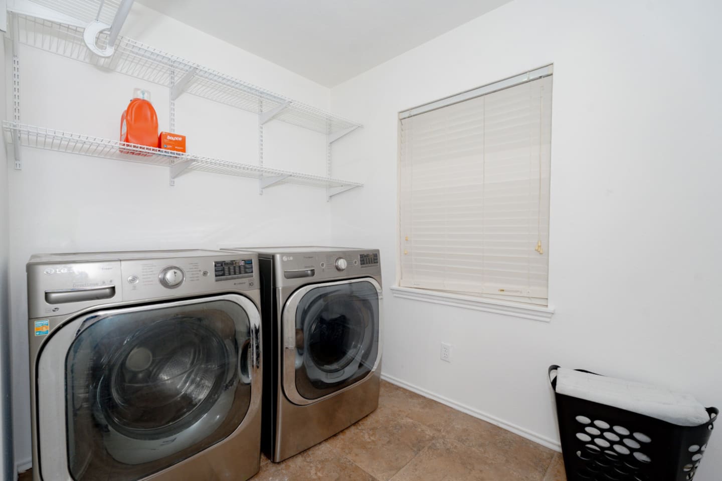Convenient laundry room with modern washer and dryer.