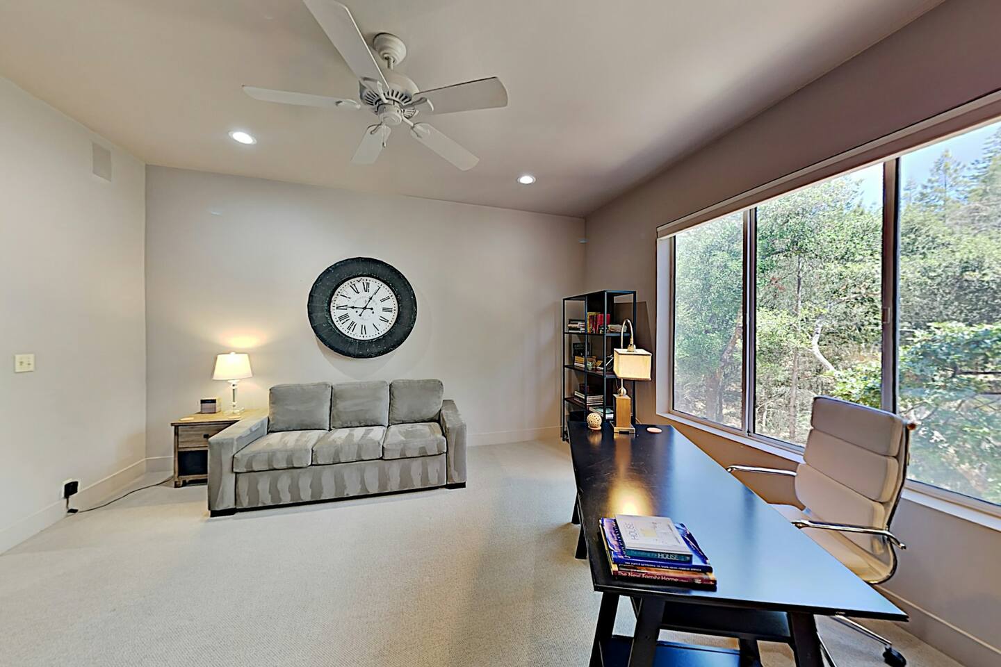 This comfortable sofa bed is located in the office.