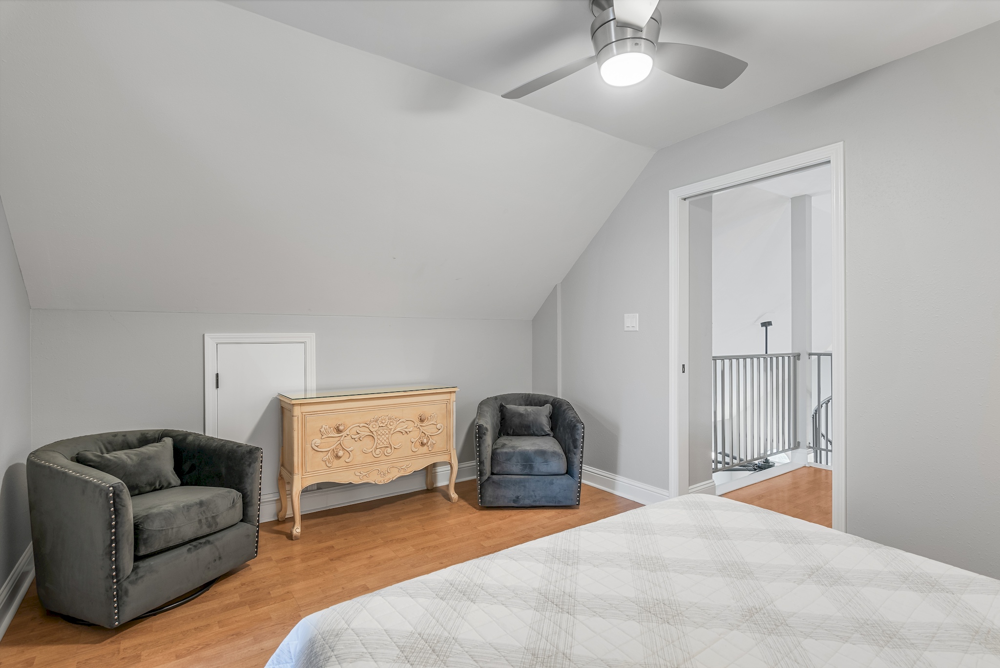 Guest bedroom with sitting area and modern furnishings