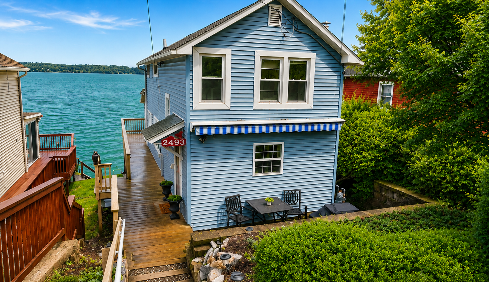 Blue cottage exterior near the shoreline