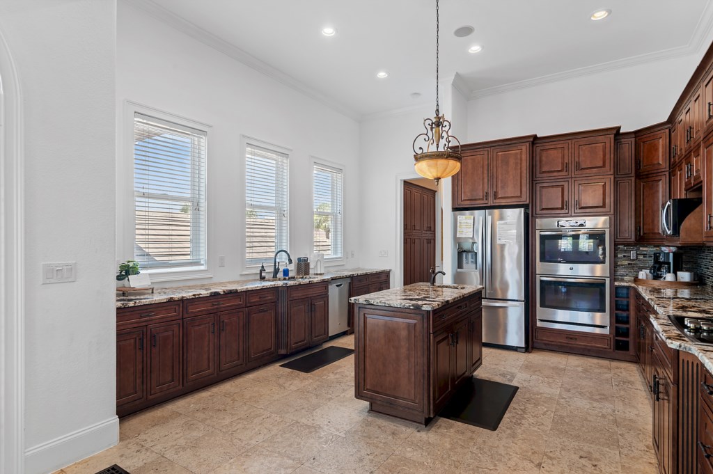 Kitchen island with prep sink and ample workspace