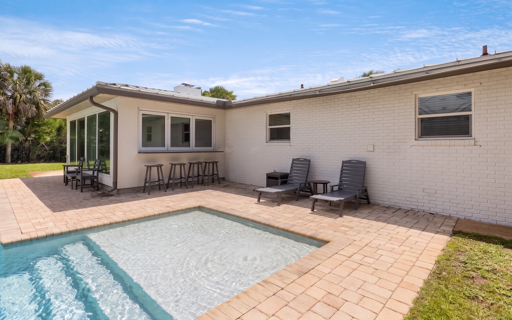 Ease into poolside hours with loungers at the water’s edge and a shallow sun shelf for cooling off.