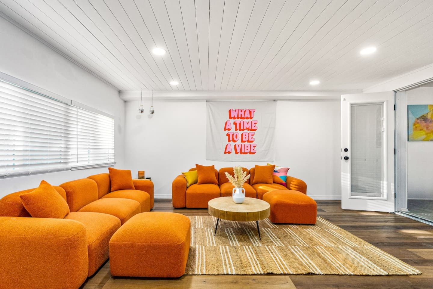 Retro living room with 75-inch LED TV.