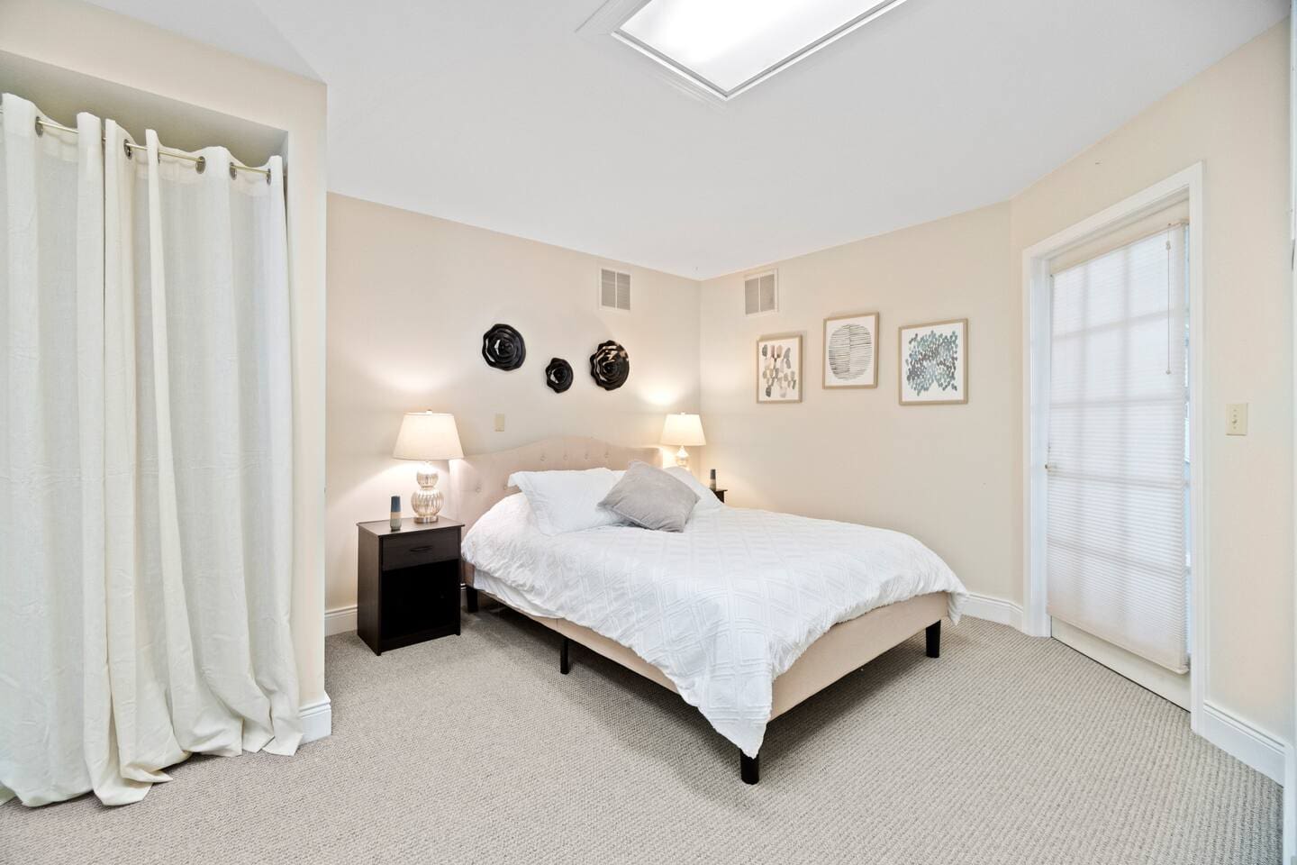 Queen-sized bedroom with a warm and cozy ambiance, offering a perfect retreat for restful nights and relaxation.