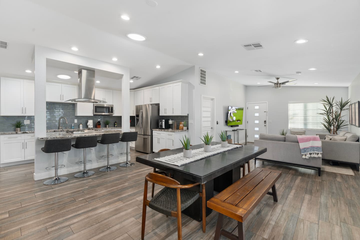 Open-concept kitchen and dining area, seamlessly fronting the spacious living area for a perfect flow of space.
