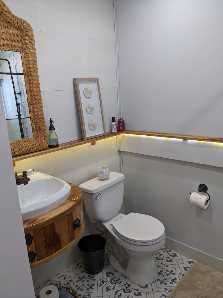 This is the 2nd bedrooms bathroom. The sink base piece was custom made because we basically look for any excuse to handcraft hardwood pieces:) 