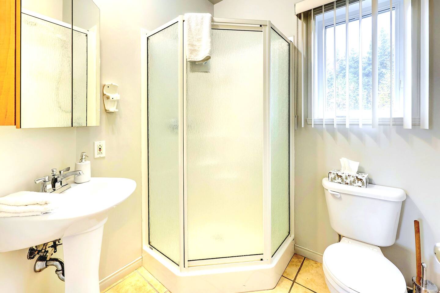 Enjoy a relaxing bath in this spacious bathroom.