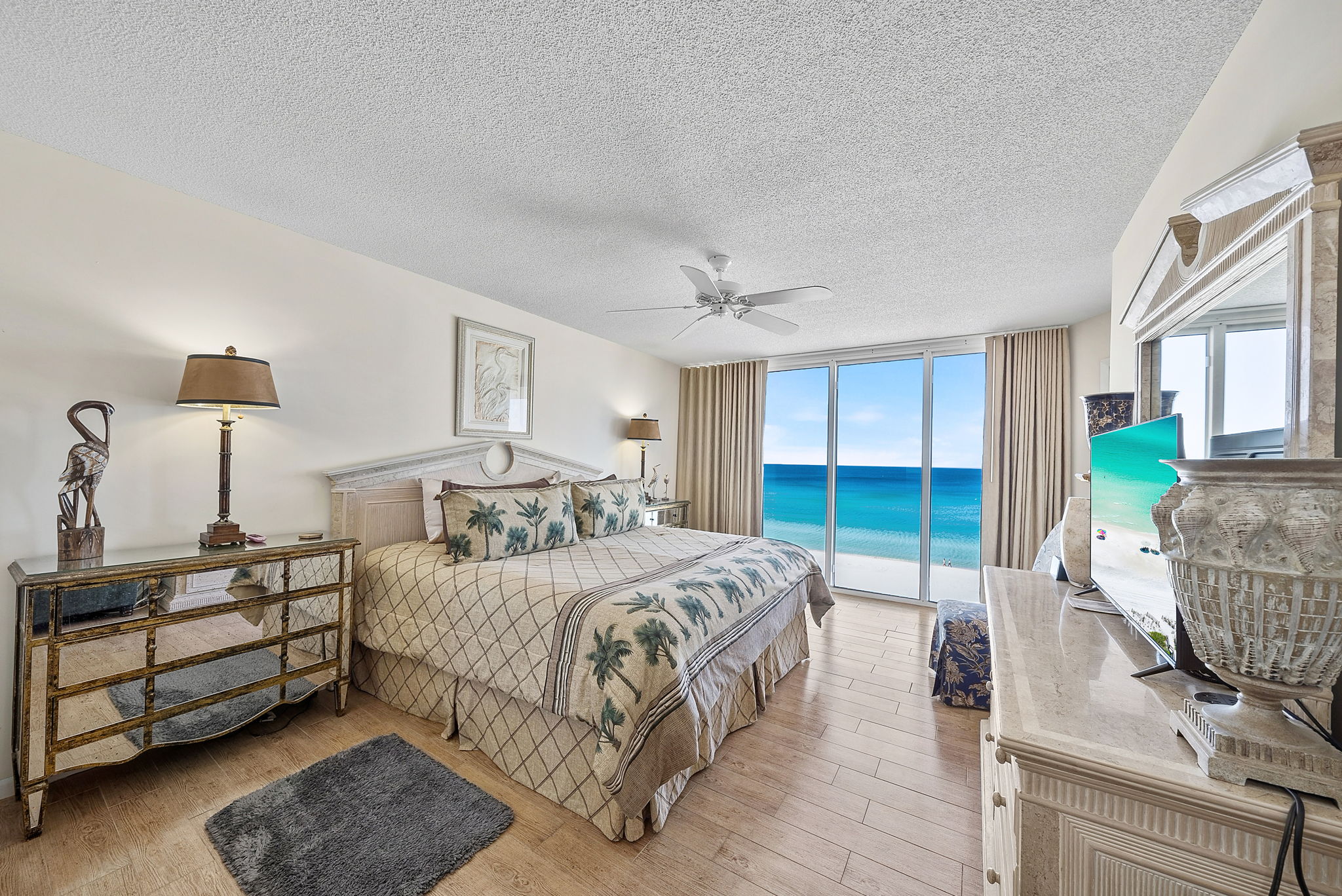 Master king suite with floor to ceiling window views of the beach, private balcony access and en-suite bathroom