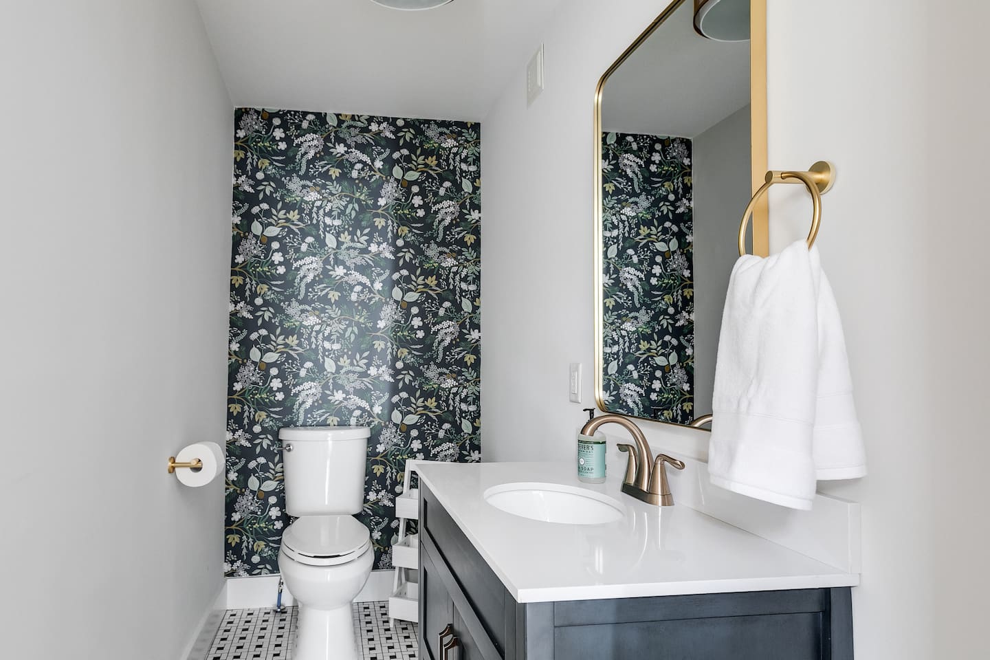 1st Floor Powder Room: Stylish floral wallpaper and modern fixtures for a refreshing touch!