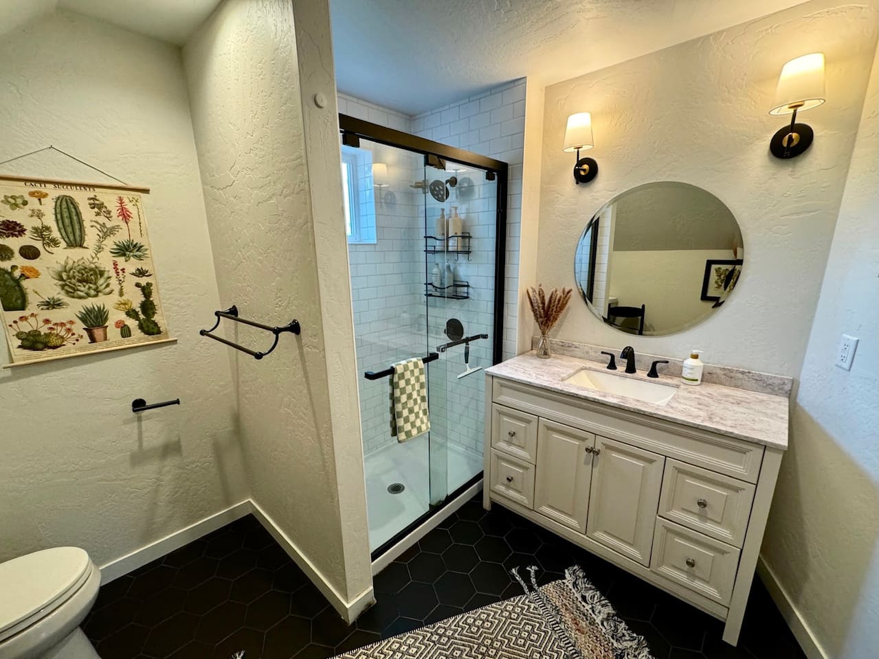 This master bathroom features a clawfoot soaking tub and shower for a relaxing bathing experience.