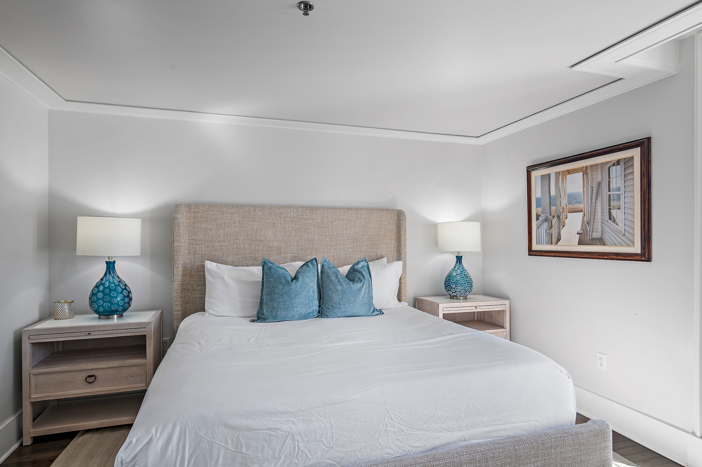 Bedroom #1 is oversized with a king bed, ensuite bath, and direct access to the large patio.