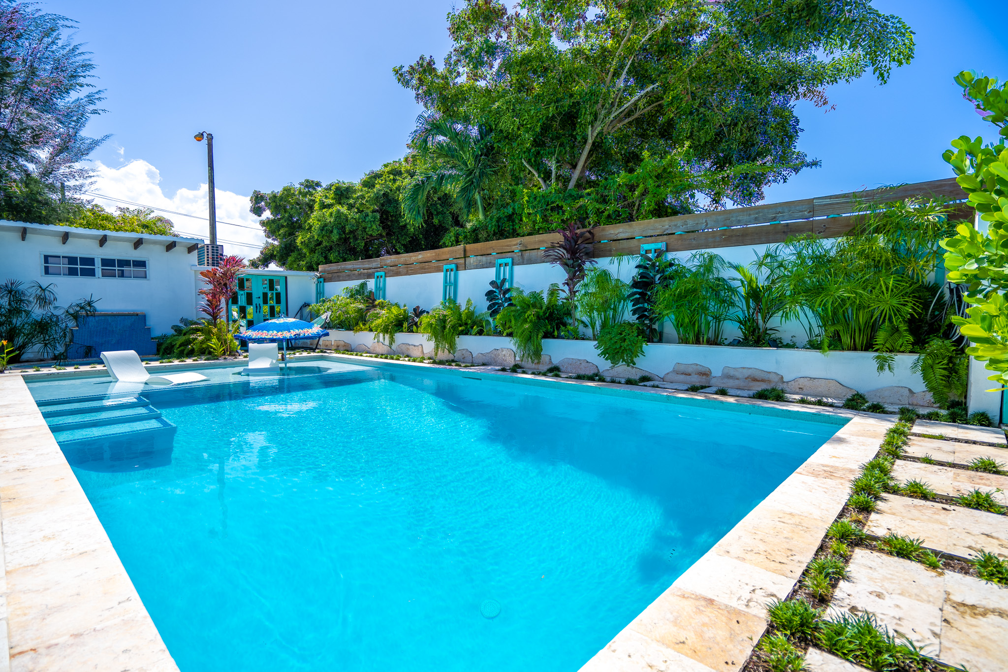 Large Salt Water pool featuring 10 ft deep end and baja shelf in Dorado, Puerto Rico.