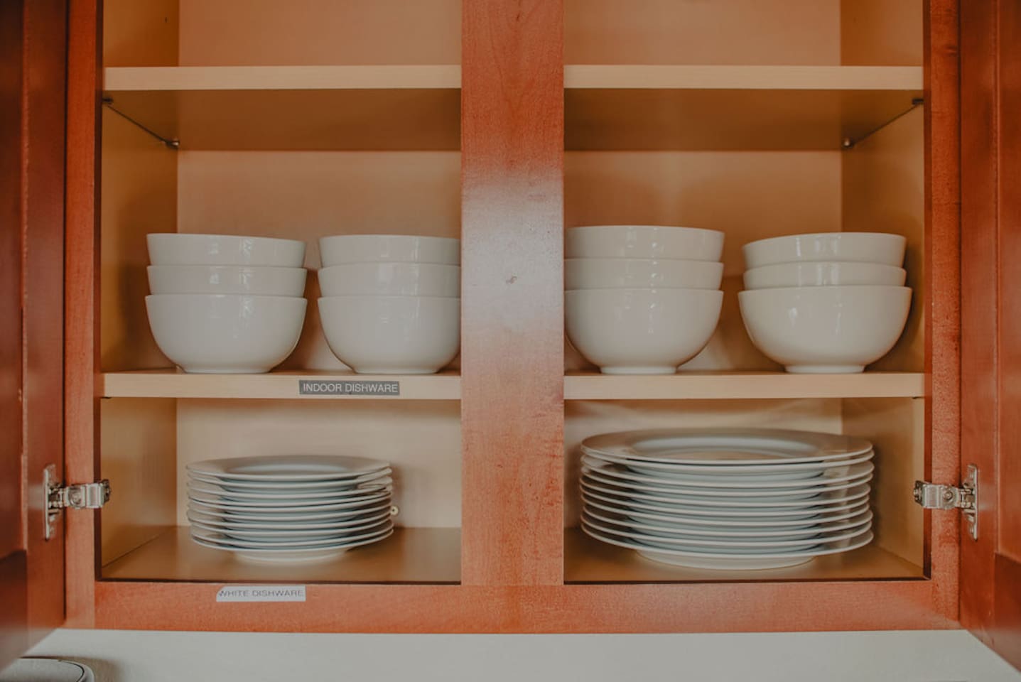 Ample dishware and serving pieces for group meals and entertaining