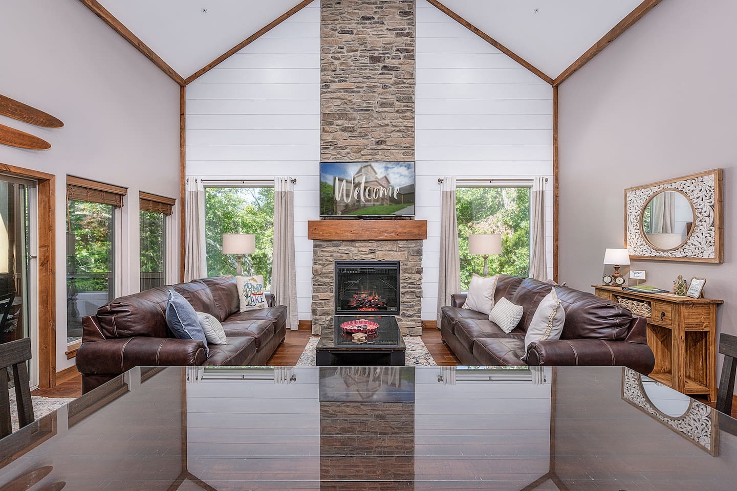 Big Great Room overlooks nature trail and creek and leads to screened in deck.