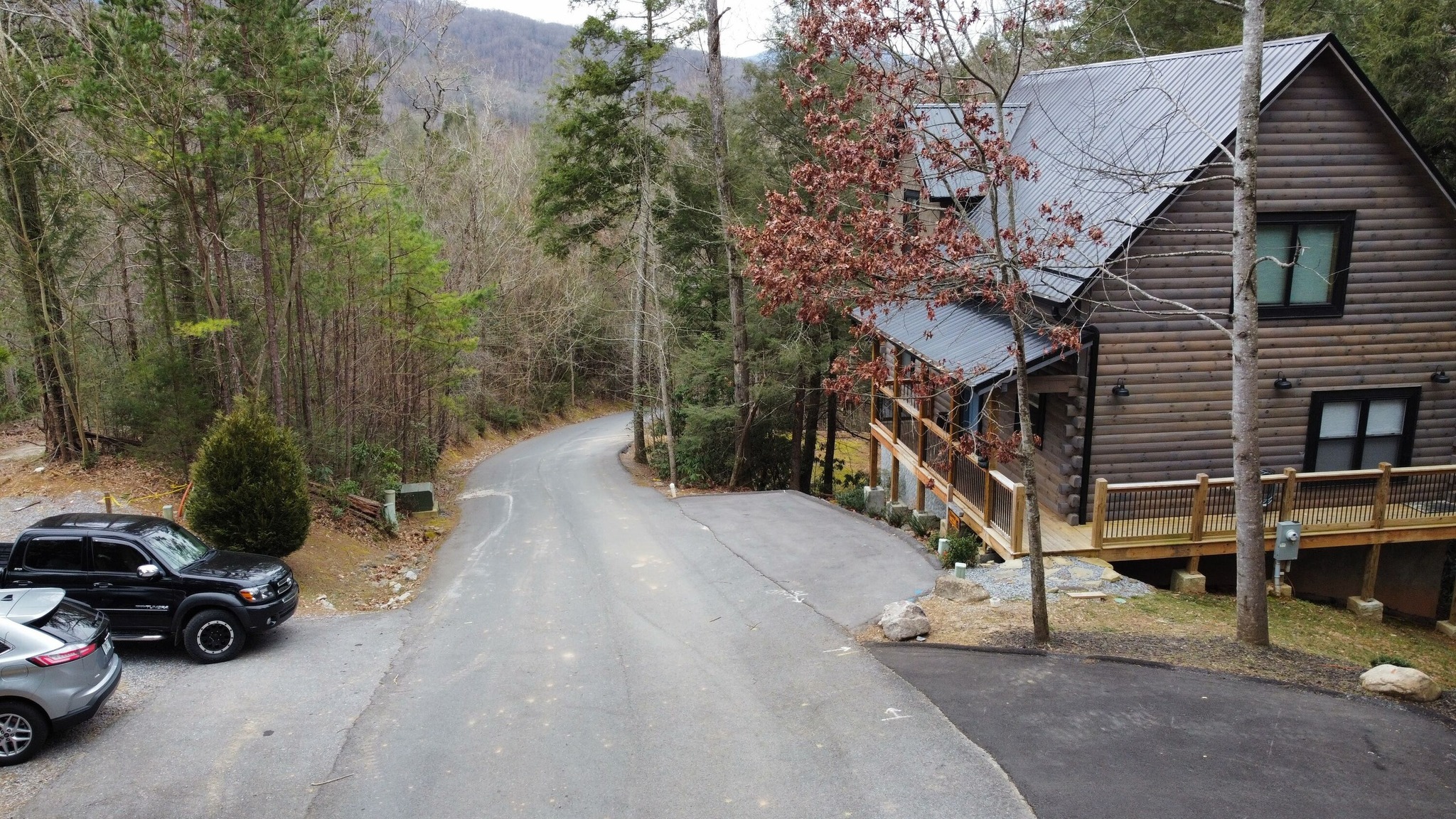 Front of Cabin and Downslope of Mountain Shadows Way