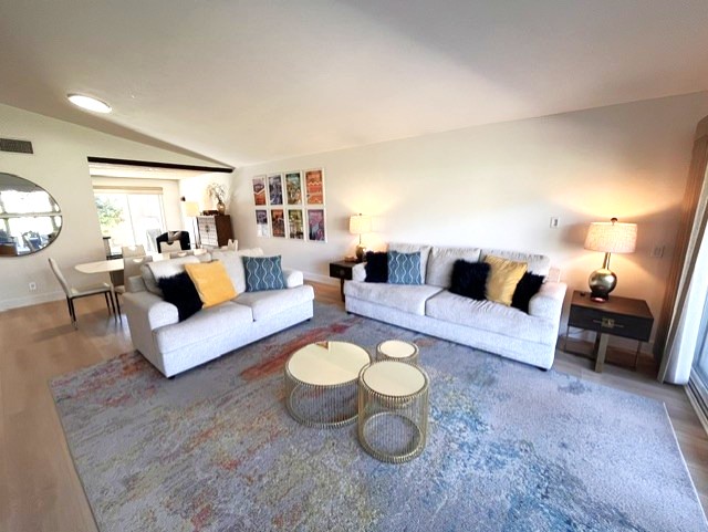 Living room with vaulted ceiling and comfortable seating for enjoying the view or TV, sofa includes a Queen Sleeper Sofa