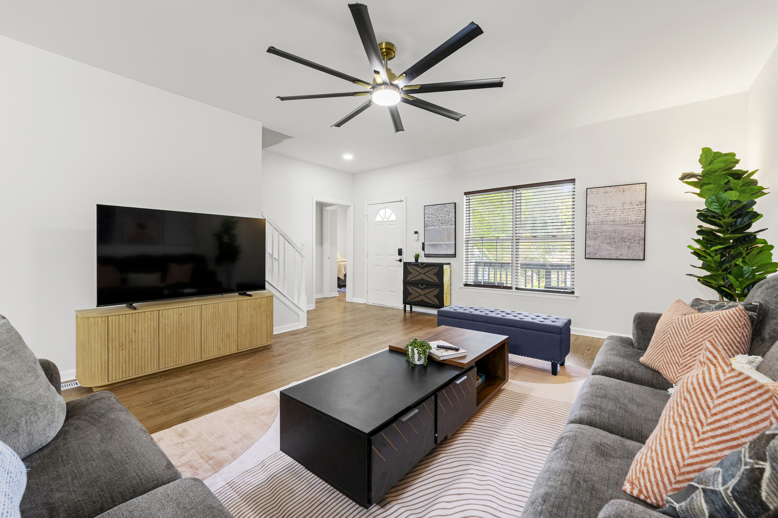 Gather everyone in this open and inviting living space designed for comfort and connection.
