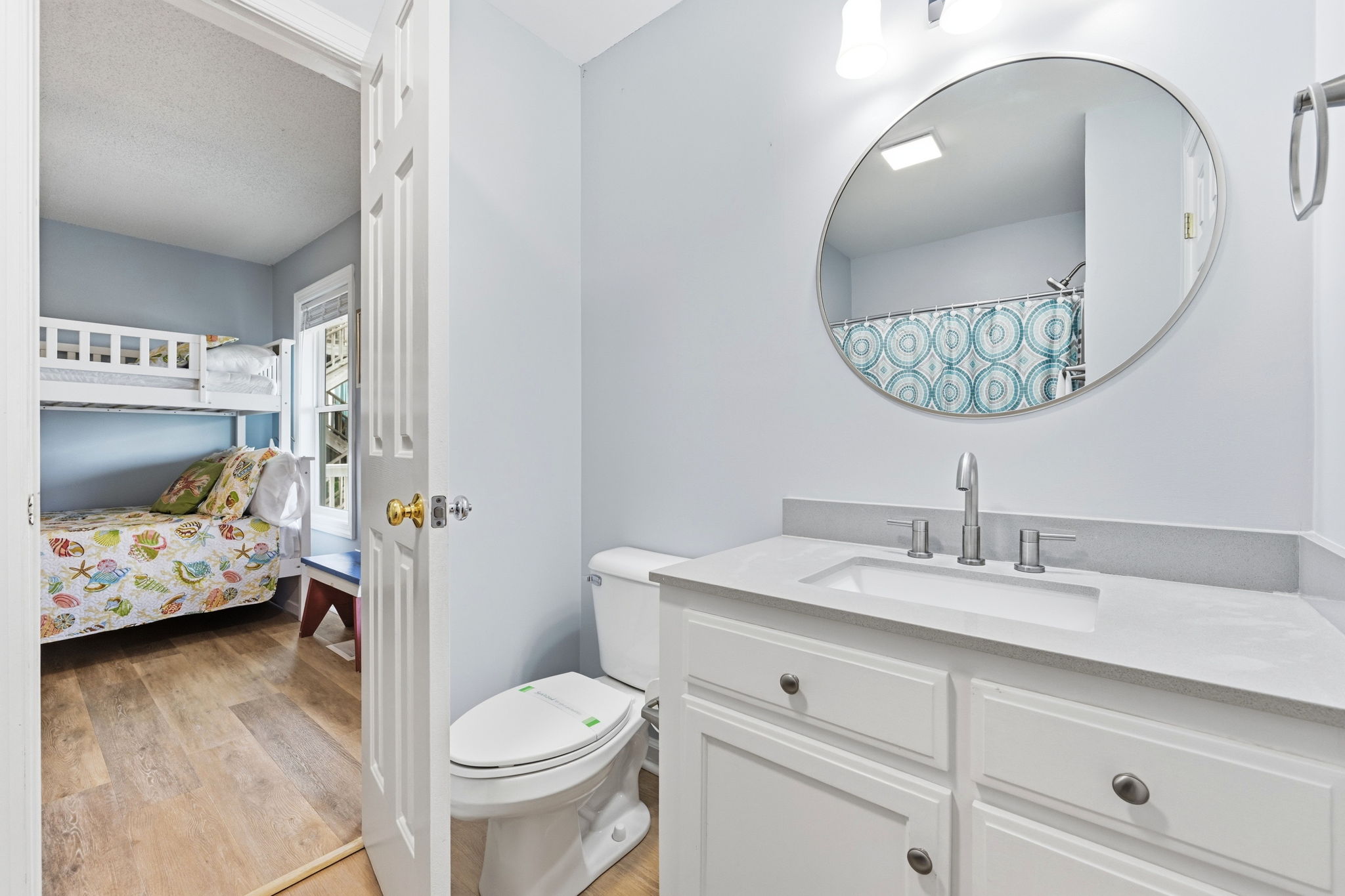 Smart layout connecting bunk rooms with a shared Jack and Jill bath