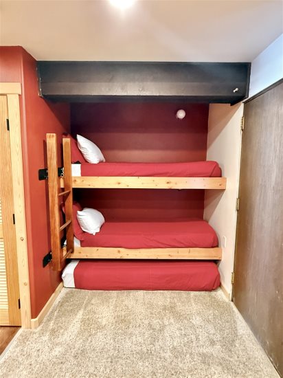 Bedroom: Twin bunkbeds, 1 twin bed under bottom bunk. 