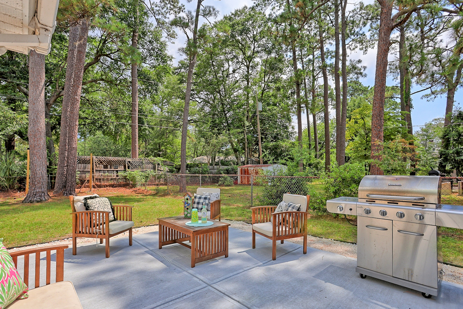 Fire up the fun—this spacious backyard features a large gas grill, perfect for cookouts and soaking up the Southern sunshine.