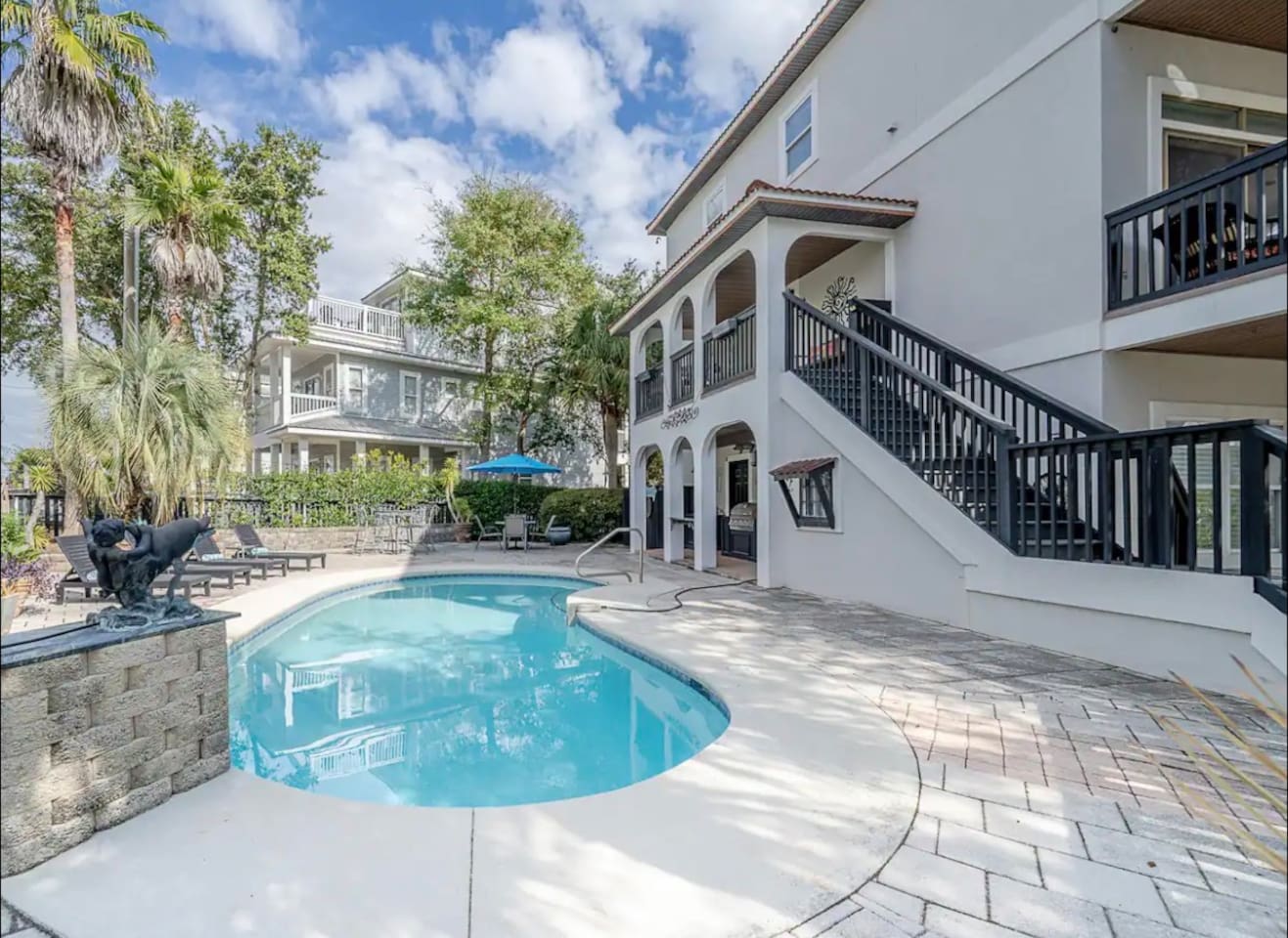 Sunlit private pool and outdoor patio area at The Copper Fin, offering the ultimate setting for outdoor entertaining and relaxation