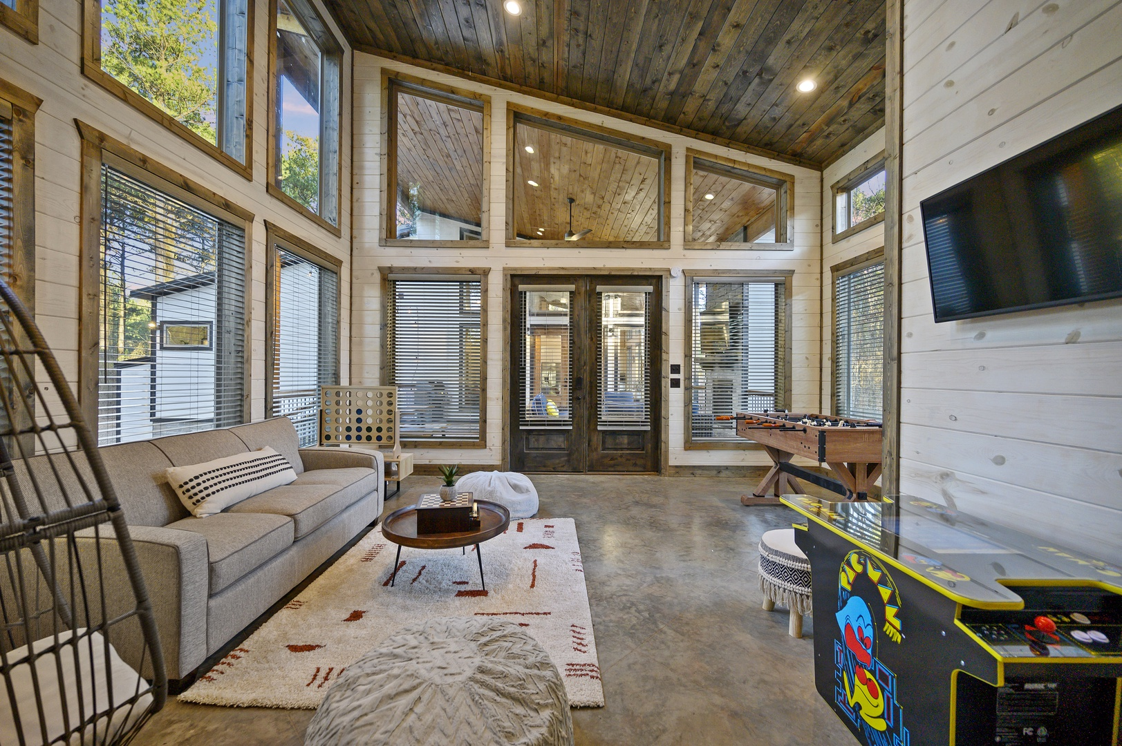 Play foosball, watch a movie, or just relax in this bright, forest-view space made for fun and connection.