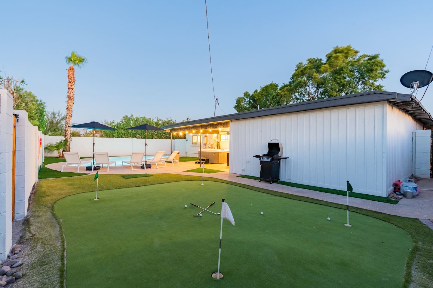 Wind down your day with a sunset game of golf and dinner on the grill under string lights.