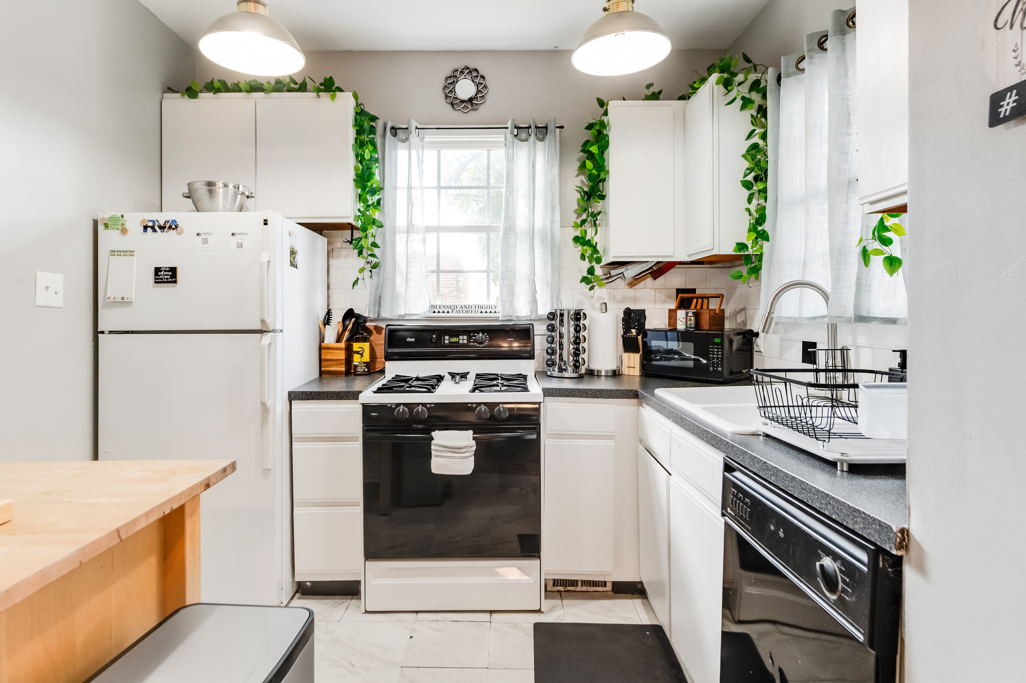 Bright Kitchen: Whip up culinary delights surrounded by modern appliances and vibrant greenery!