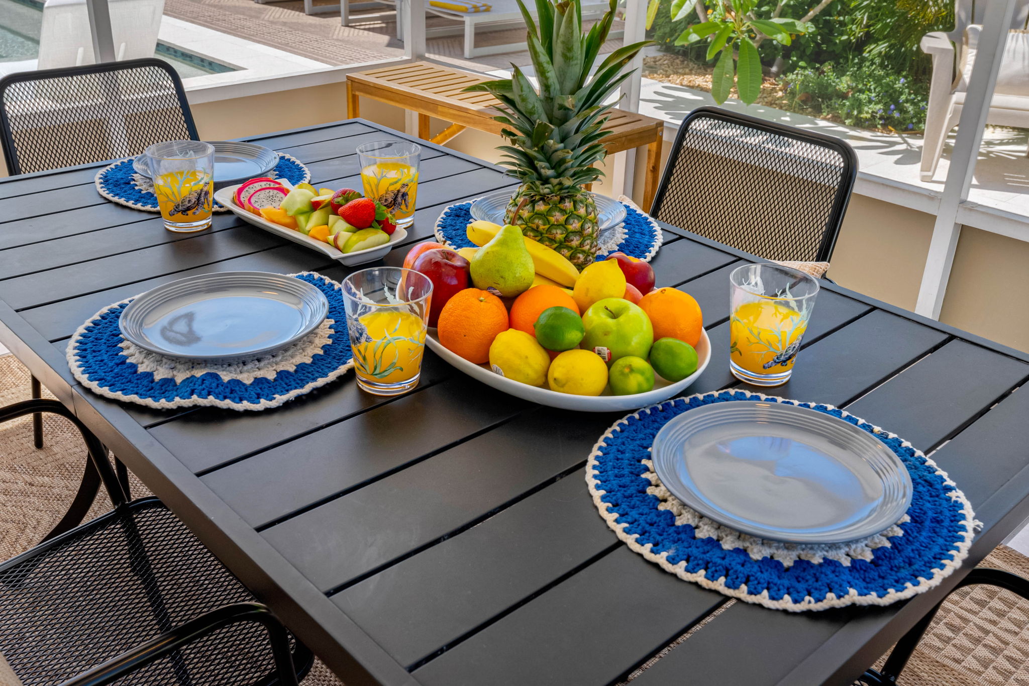 With chic patio furniture, lush greenery, and a crystal-clear heated pool, you won’t want to leave this backyard.