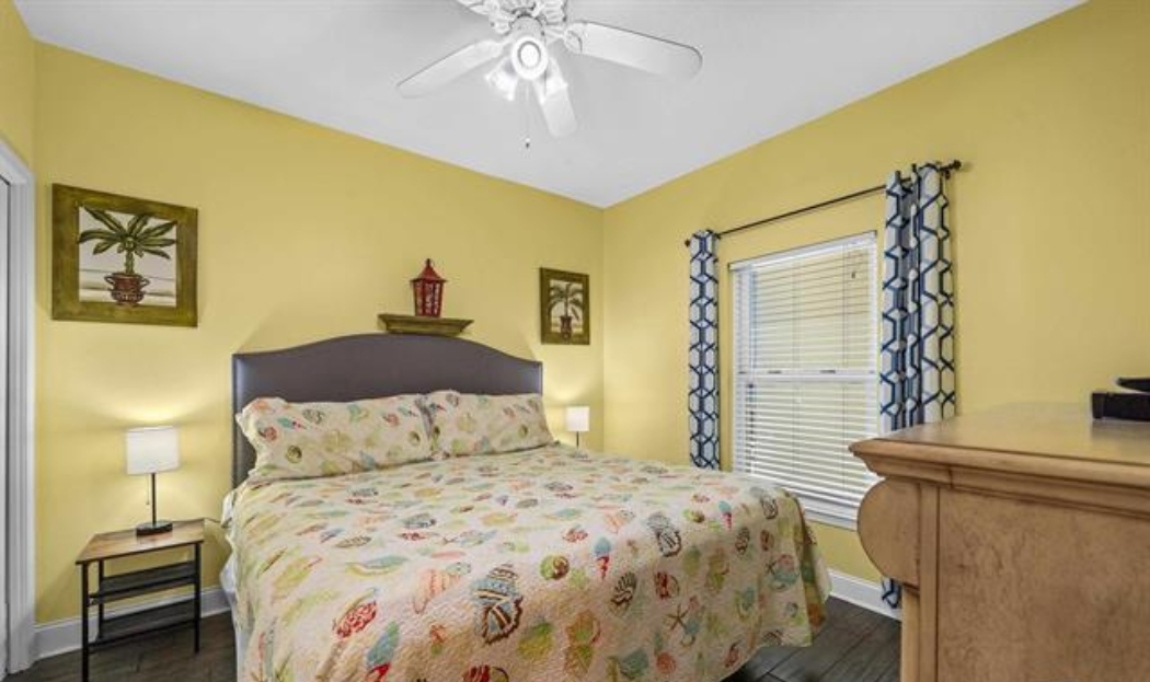 2nd bedroom with king bed, 50" Smart TV, double closet, ceiling fan, 2 bedside tables, 2 lamps & wn-suite bathroom