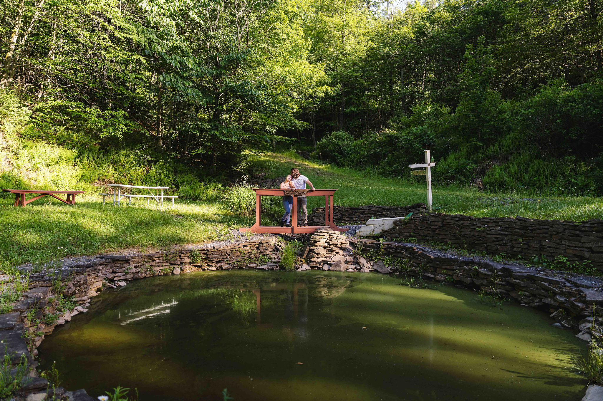 🐟 A peaceful stone bridge over the on-property pond.
