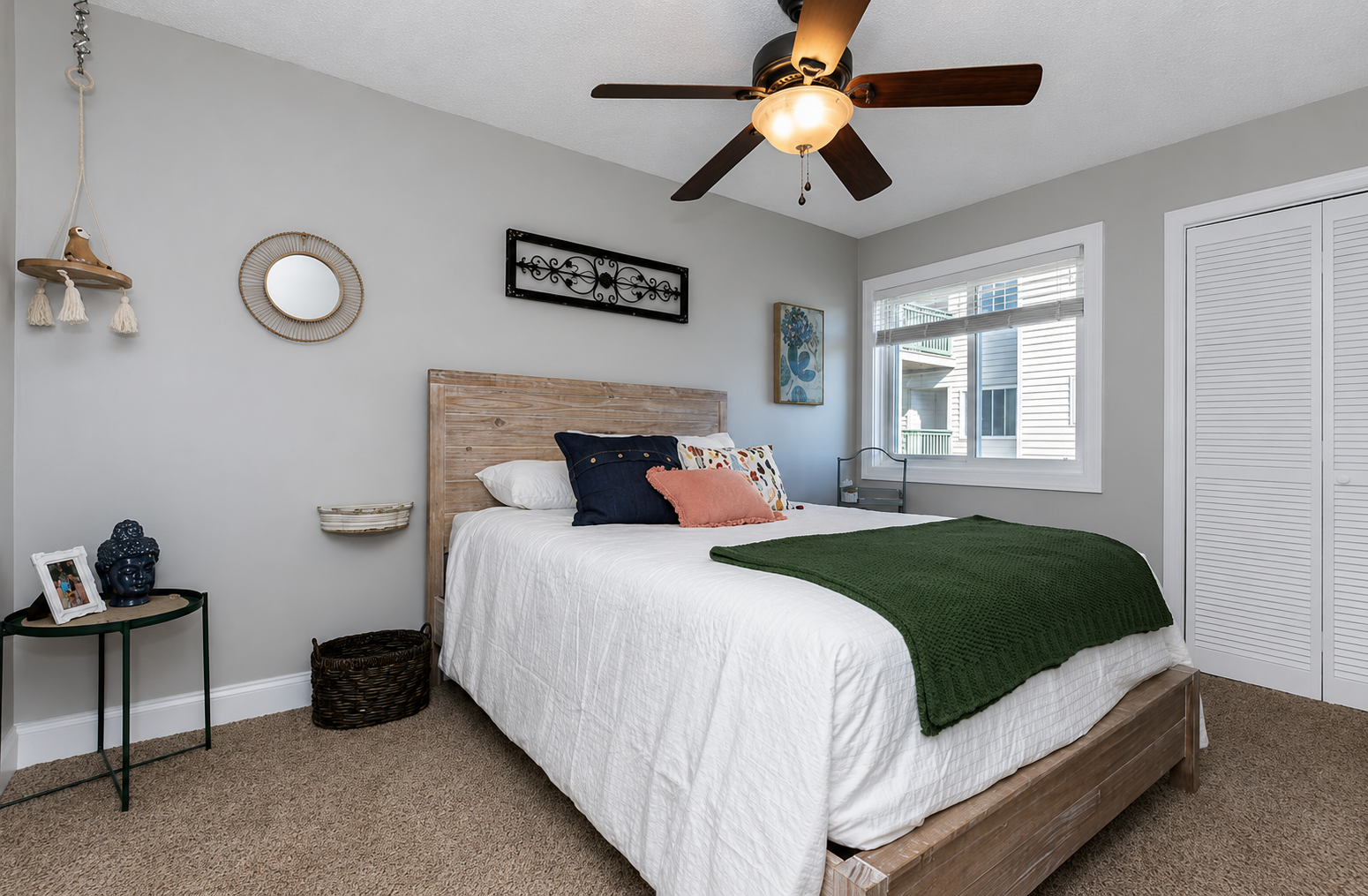 Cozy second bedroom—perfect for family or friends. Queen sized bed with TV and closet. Ceiling fans in all bedrooms for comfort as the unit does not have A/C.