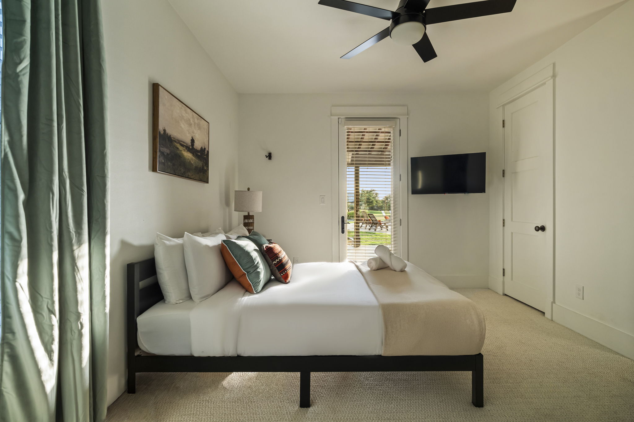 Includes a TV, ceiling fan, and bedside lamp for comfort and convenience.