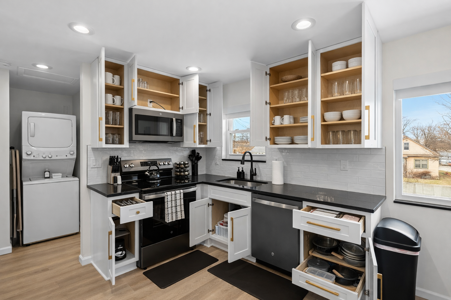 Fully equipped kitchen with ample storage, modern appliances, and in-unit laundry—designed for effortless cooking and comfortable longer stays.