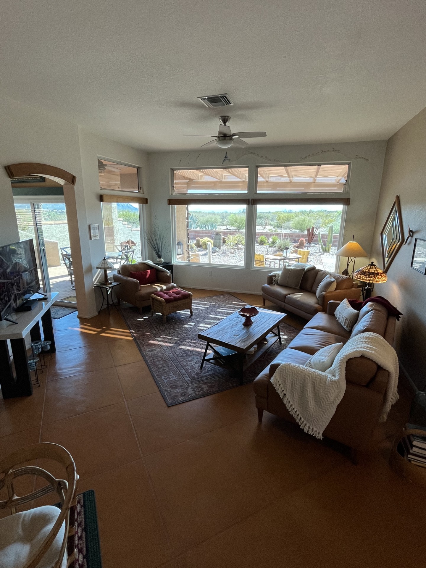 Spacious, bright and sunny living room area with mountain views.