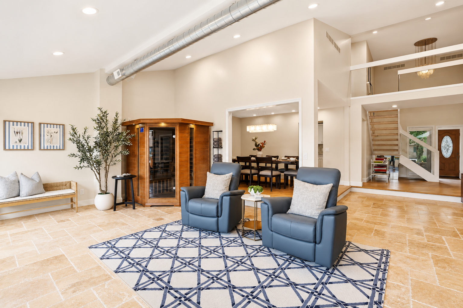 Relax in this spacious indoor pool lounge featuring a private sauna, soaring ceilings, and comfortable seating areas. The open-concept design creates the perfect space to unwind, gather with family and friends, or enjoy a luxury resort-style experience