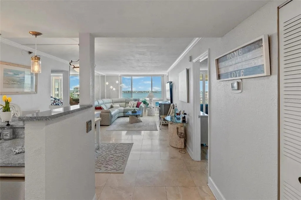 Bright and inviting, the living room is filled with natural light and offers a comfortable space to relax, stream your favorite shows, or unwind together while enjoying the coastal bay area ambiance.