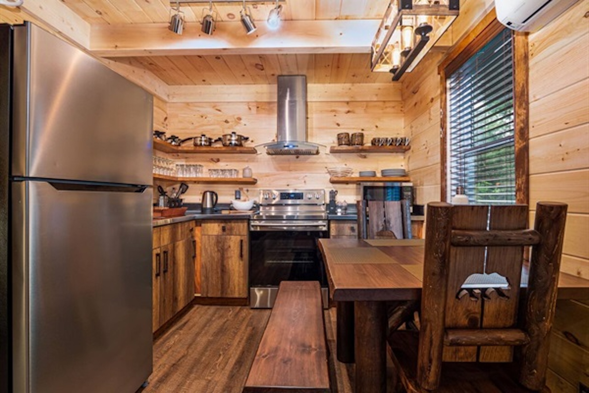 Kitchen and dining space with warm wood interior