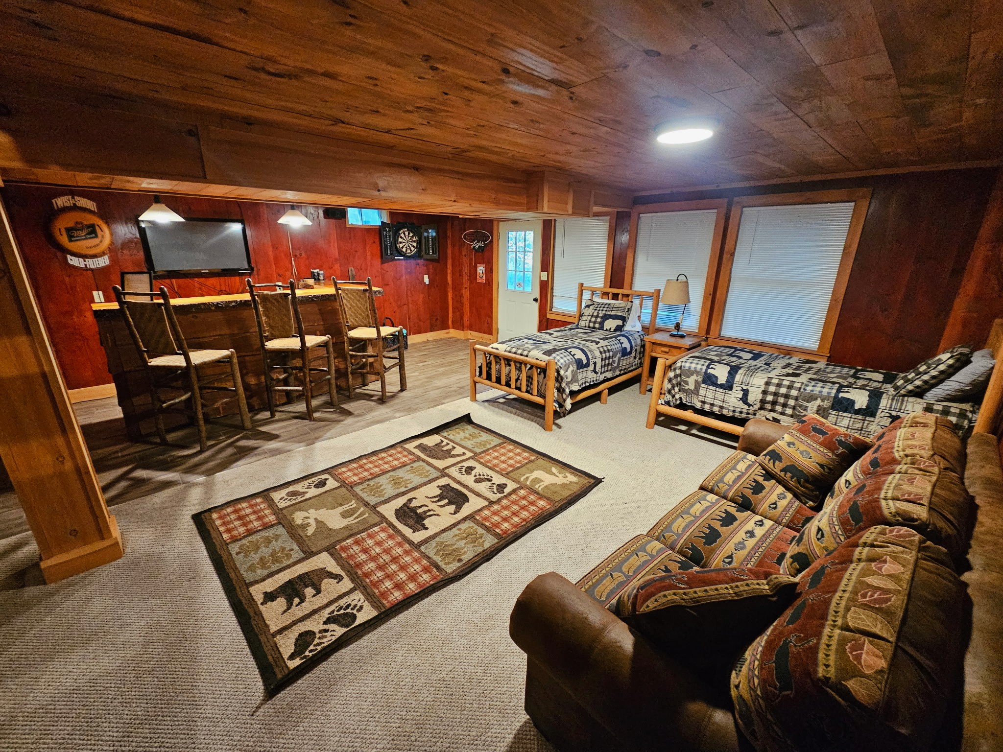 Twin beds, a sofa bed, television, darts, and games are available in the walk-out finished basement.