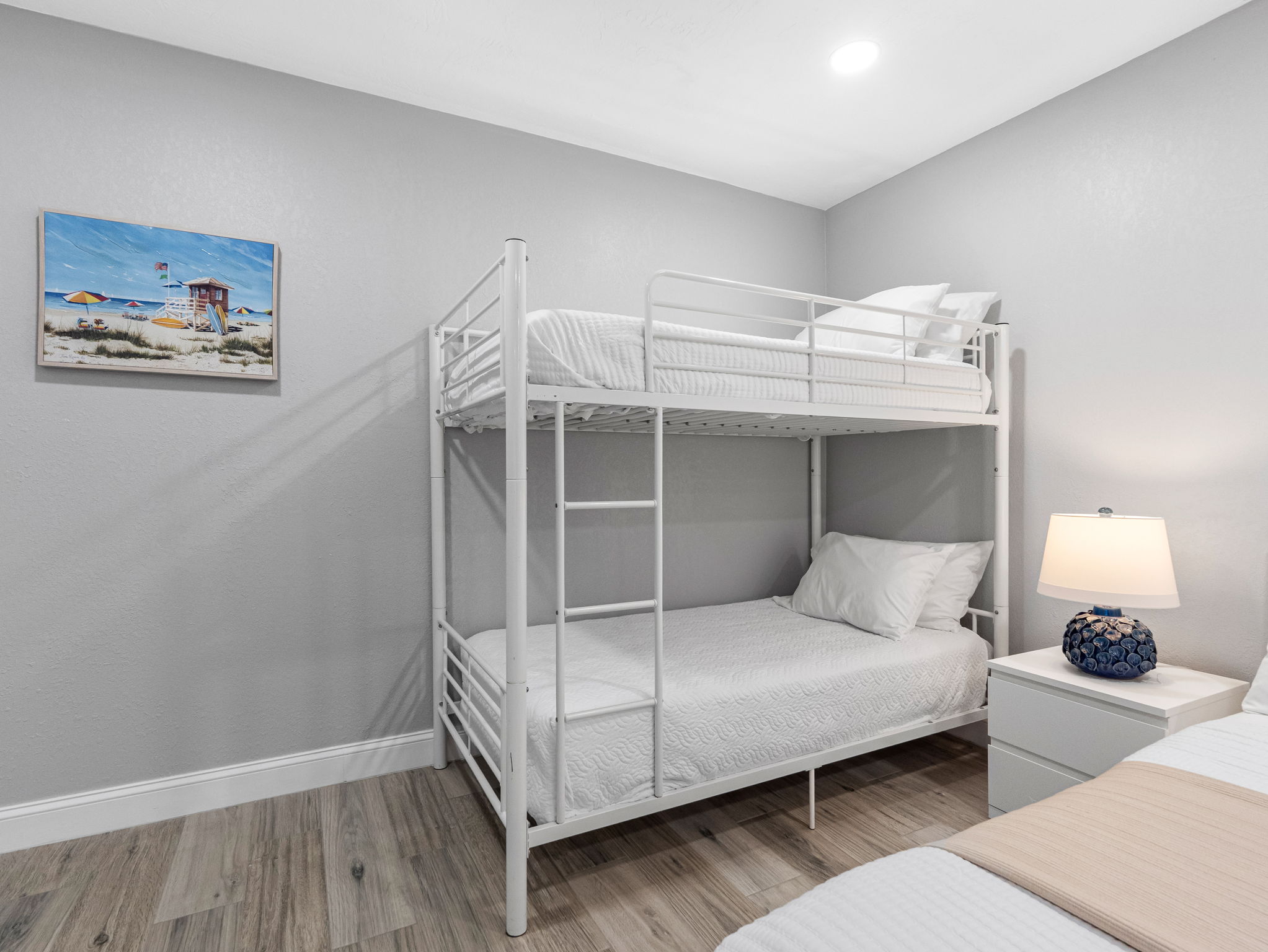 This thoughtfully designed room keeps the whole family close, offering both cozy king accommodations and fun bunk beds for the little ones