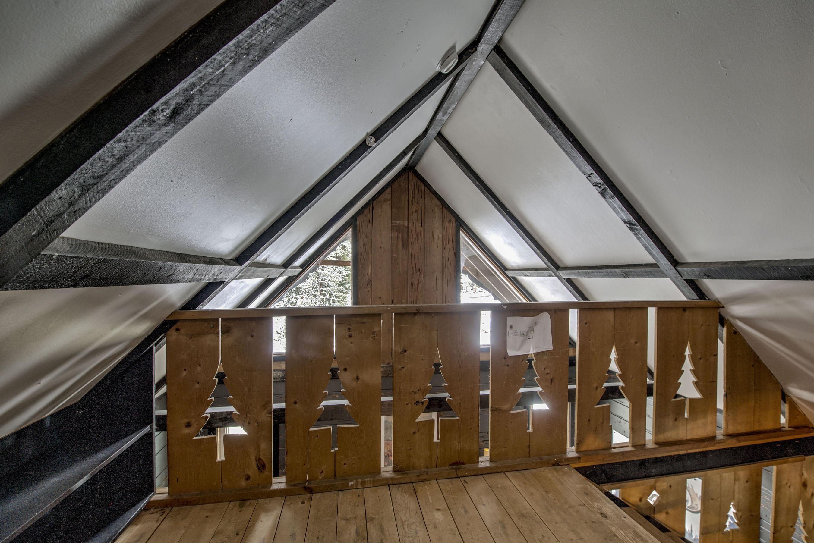Escape to your charming loft—vaulted ceilings, rustic wood details, and a cozy hideaway that feels like your own private retreat.