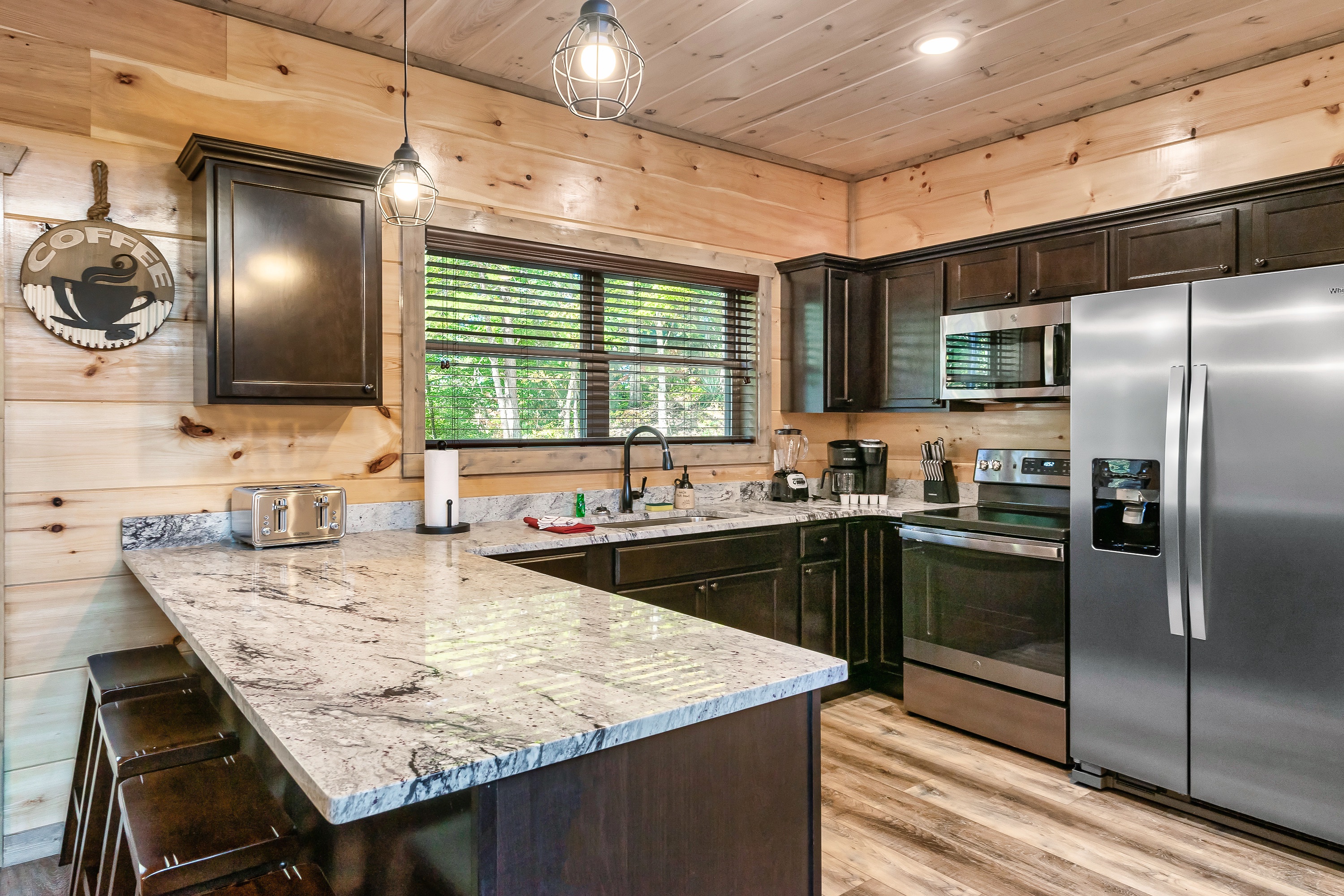 Spacious Kitchen With Bar Seating For Guests
