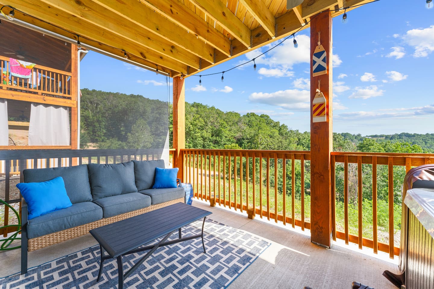 Relax on the covered deck overlooking the beautiful Ozark scenery