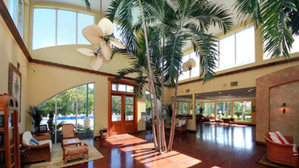 Clubhouse lounge areas with tables and nearby grills