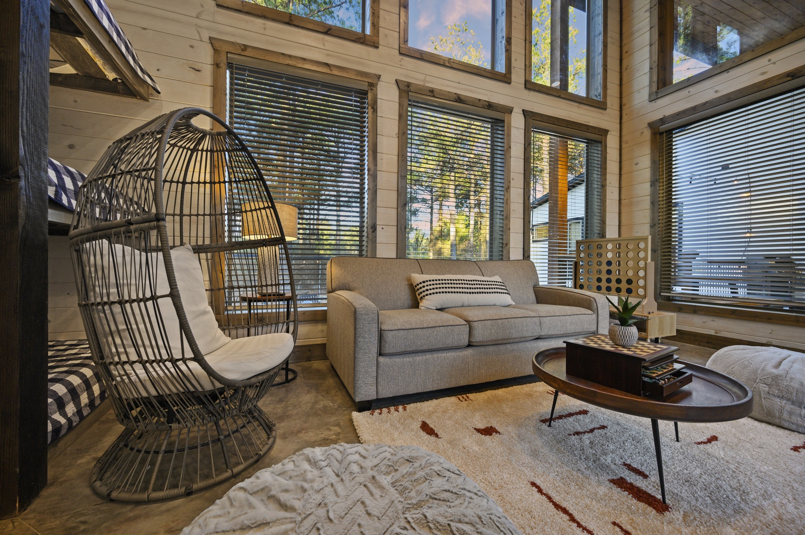 A bright and cozy sitting nook for reading, relaxing, or soaking in peaceful forest views.