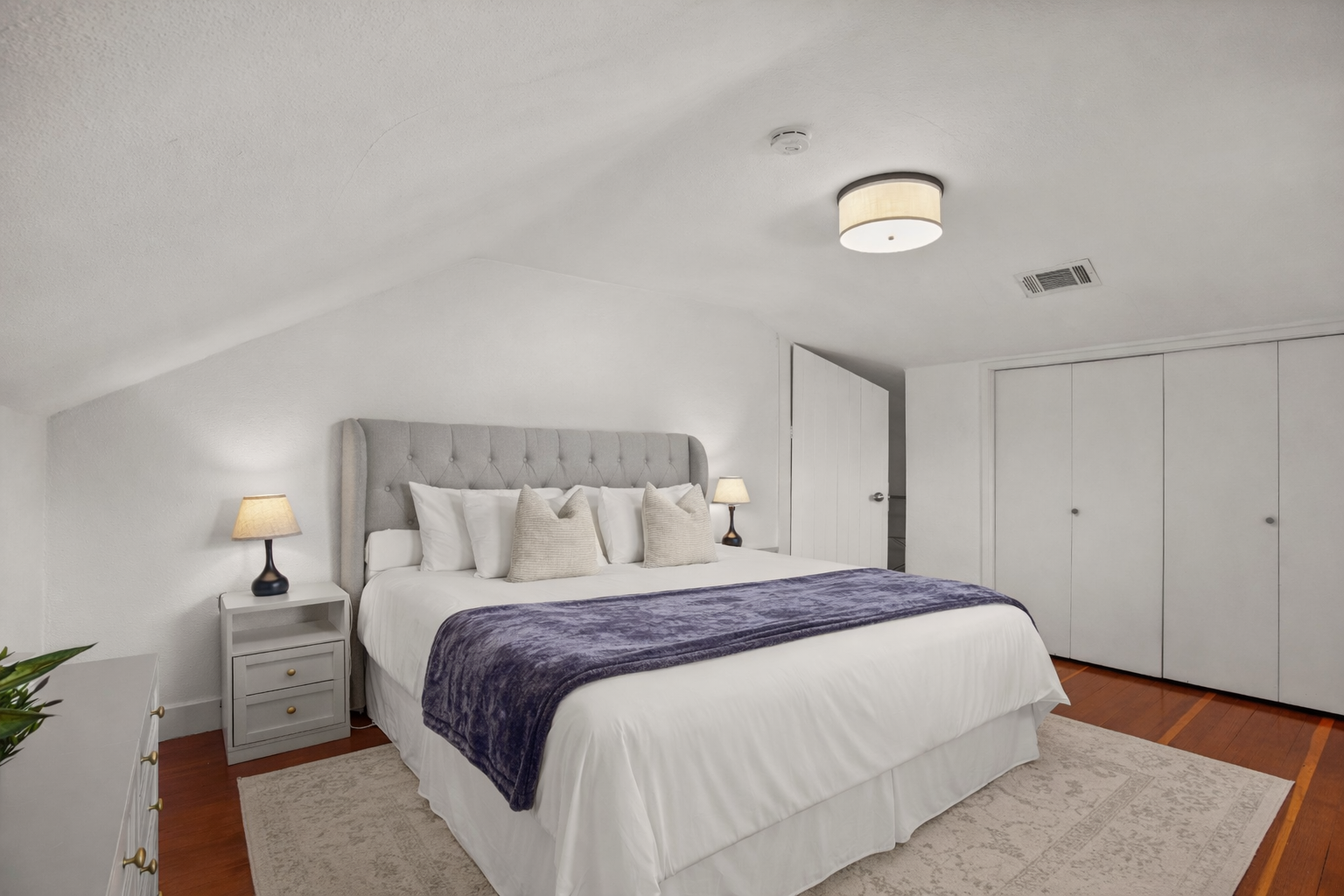 Unwind in the spacious primary bedroom featuring a comfortable king bed, Smart TV, and a large closet for all your belongings. Designed with comfort in mind, it's the perfect private retreat after a day of exploring Napa Valley.