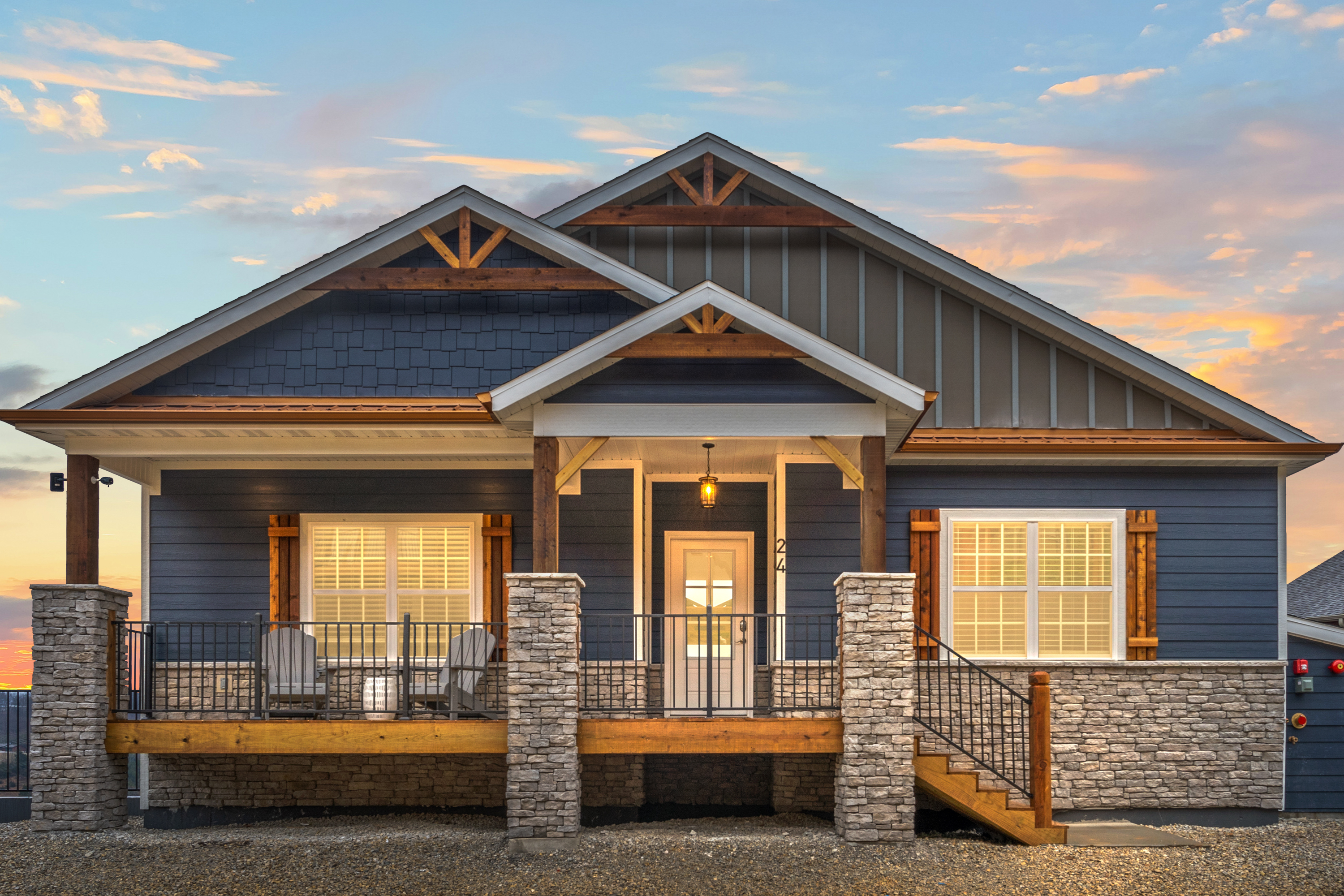 Front porch with Adirondak chairs to sit and relax.